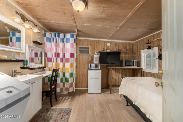 a kitchen with refrigerator and cabinets