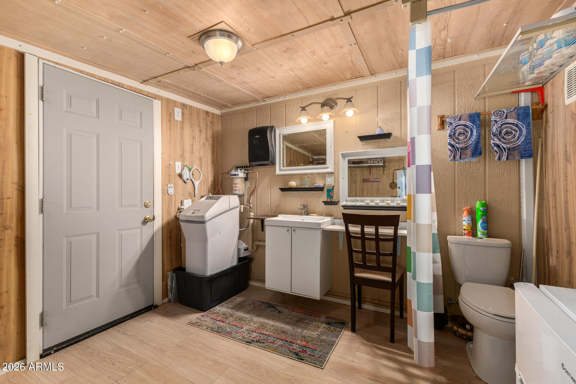 834 South Meridian Road, Unit 144 Apache Junction, AZ 85120 - Photo 26 of 43 a view of bathroom with a toilet sink a mirror and a shower