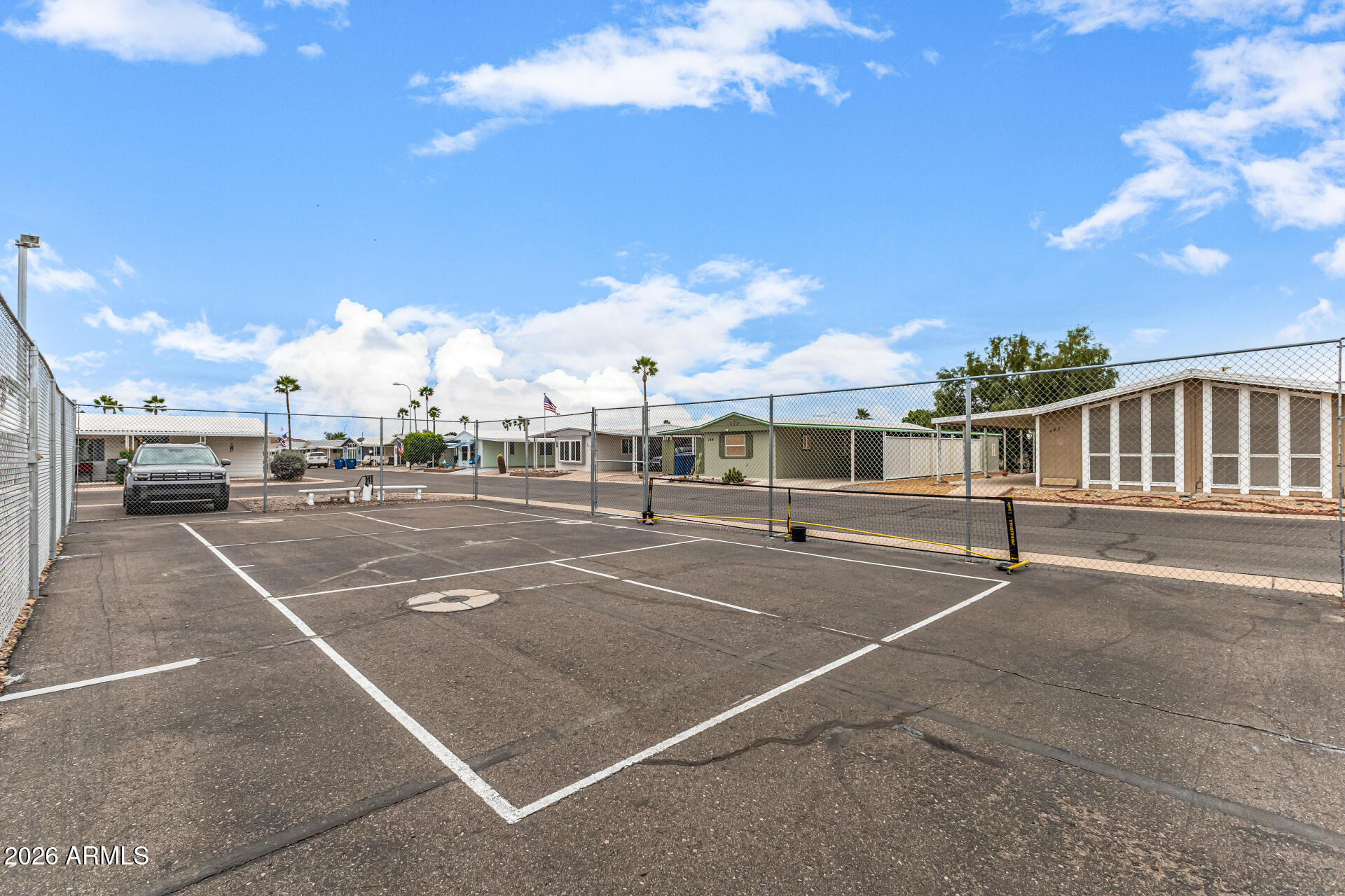 834 South Meridian Road, Unit 144 Apache Junction, AZ 85120 - Photo 35 of 43 a view of a tennis court