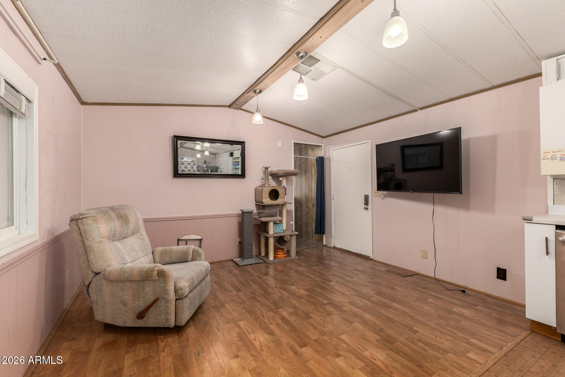 834 South Meridian Road, Unit 144 Apache Junction, AZ 85120 - Photo 8 of 43 a living room with furniture and a flat screen tv