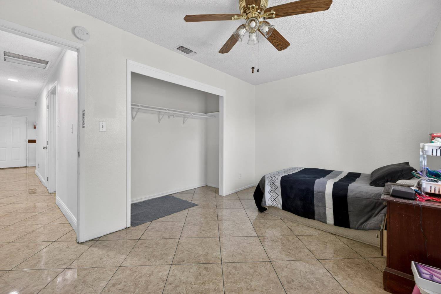 13591 East 5th Street Parlier, CA 93648 - Photo 15 of 31 a view of a livingroom with a chandelier fan and windows