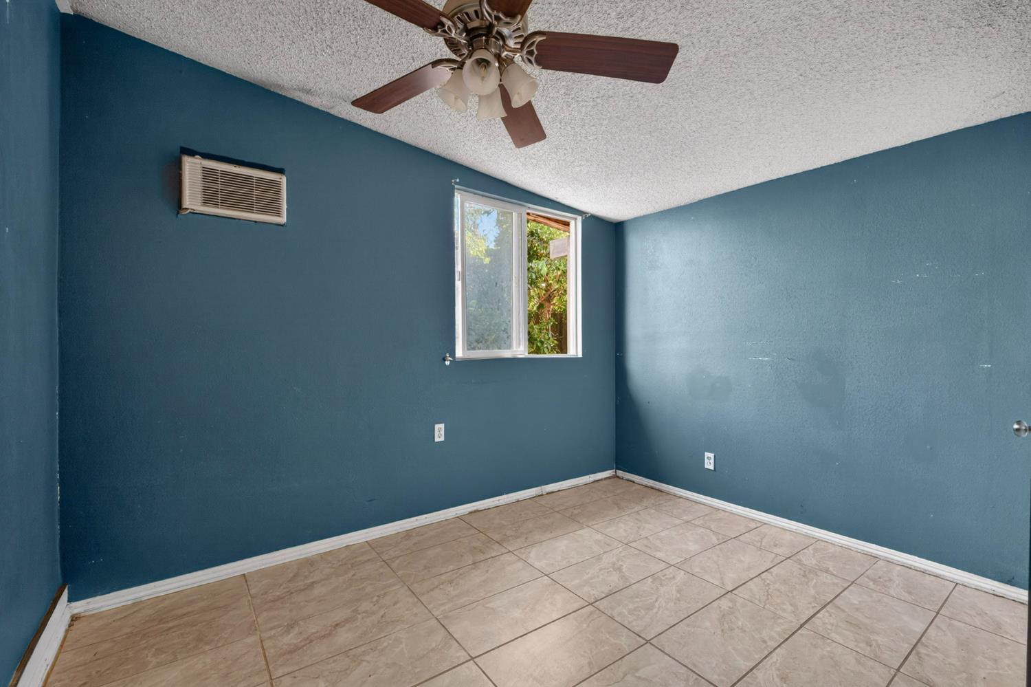 13591 East 5th Street Parlier, CA 93648 - Photo 25 of 31 a view of an empty room with a window
