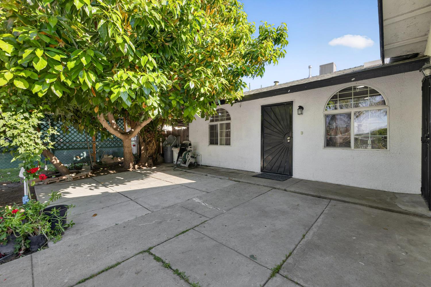 13591 East 5th Street Parlier, CA 93648 - Photo 5 of 31 a view of a house with a backyard