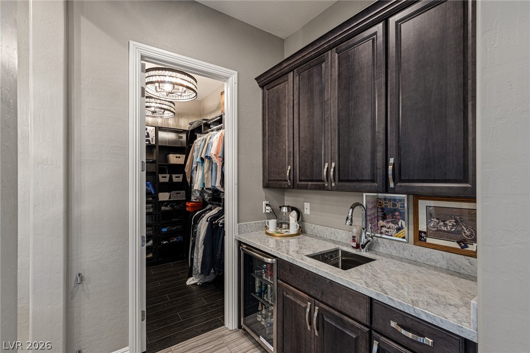 10118 Copper Edge Road Las Vegas, NV 89148 - Photo 13 of 48 Custom cabinetry and ample counter space complement this well-appointed utility area.