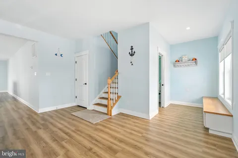 a bathroom with a granite countertop sink and vanity