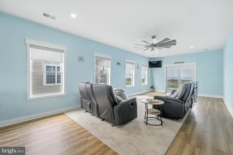 a view of a balcony with wooden floor
