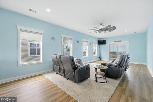 a view of a balcony with wooden floor