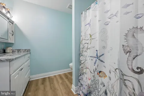 a bedroom with a large bed and a large window