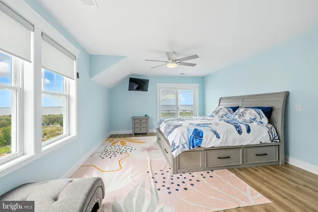 a en suite bathroom with a granite countertop sink and a mirror