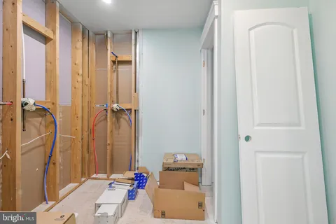 a spacious bedroom with a bed and a window