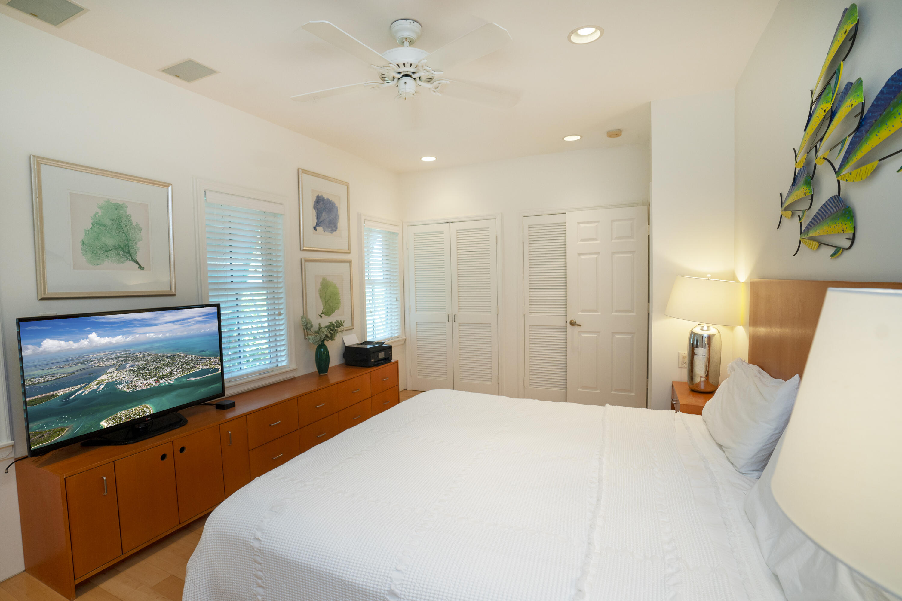 70 Sunset Key Drive Key West, FL 33040 - Photo 11 of 22 a bedroom with a bed and a flat screen tv