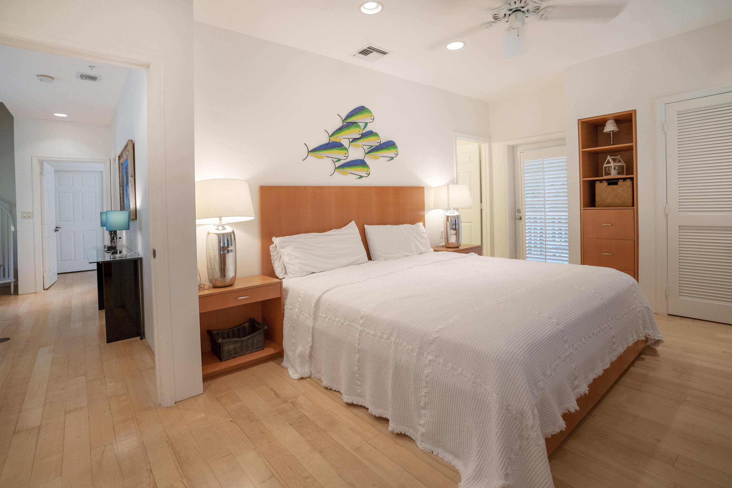 70 Sunset Key Drive Key West, FL 33040 - Photo 12 of 22 a bedroom with a bed and a painting on the wall