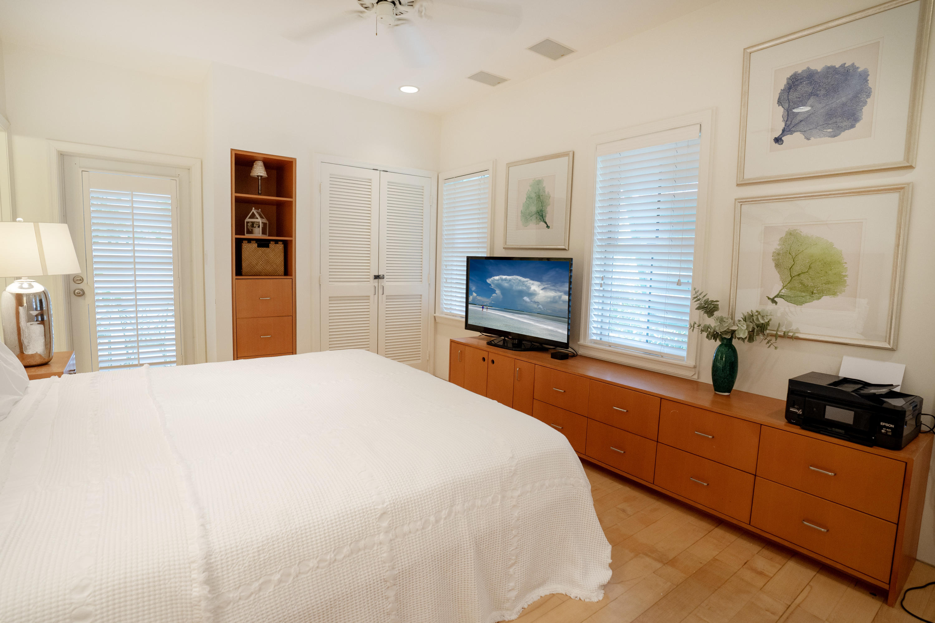 70 Sunset Key Drive Key West, FL 33040 - Photo 13 of 22 a bedroom with a bed and a television in it