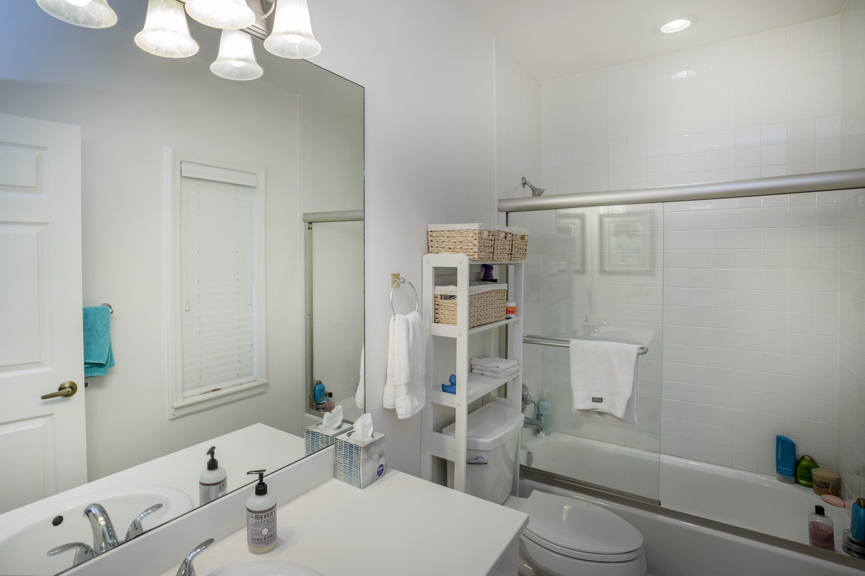 70 Sunset Key Drive Key West, FL 33040 - Photo 14 of 22 a bathroom with a sink vanity mirror and toilet