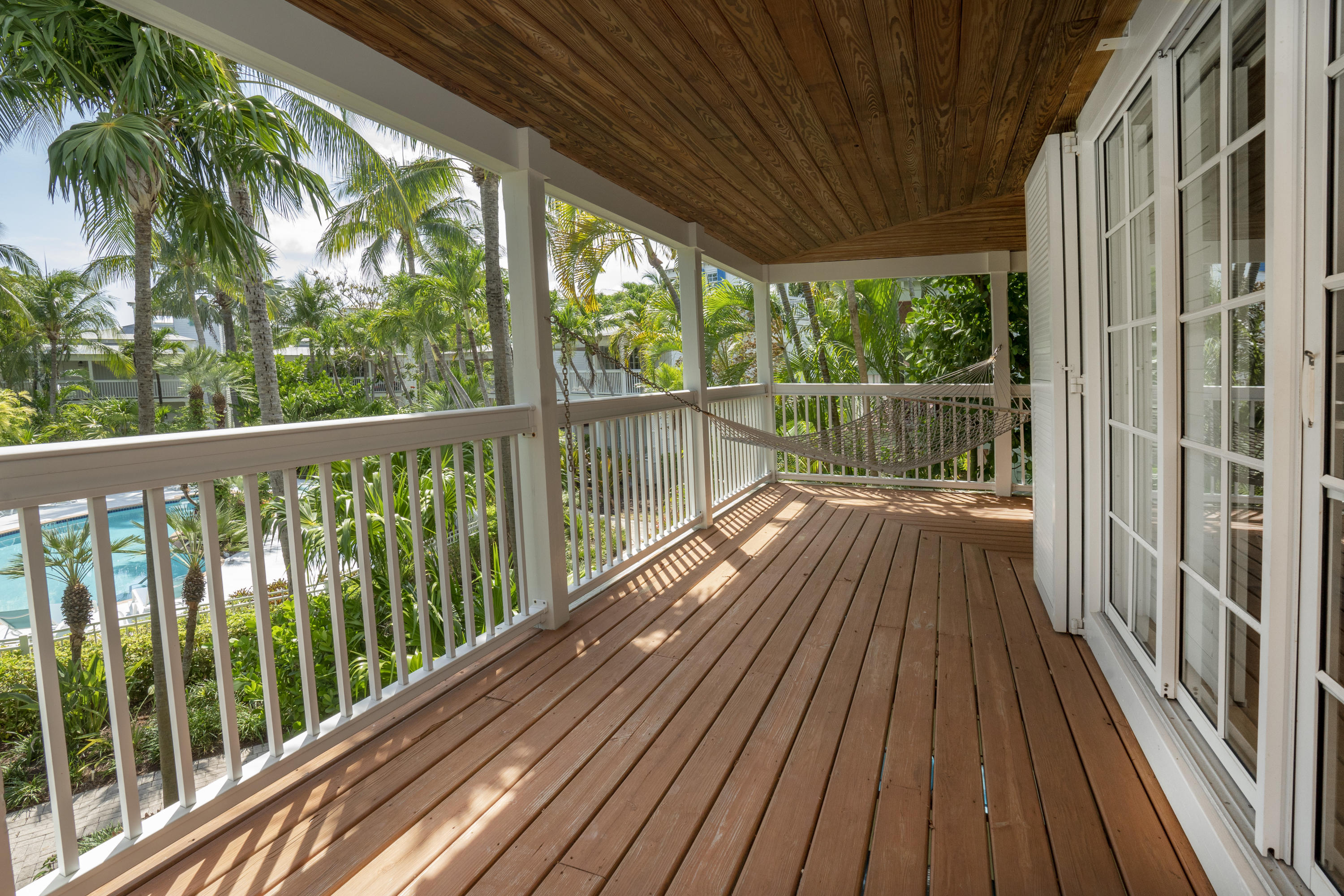 70 Sunset Key Drive Key West, FL 33040 - Photo 15 of 22 a view of balcony with wooden floor