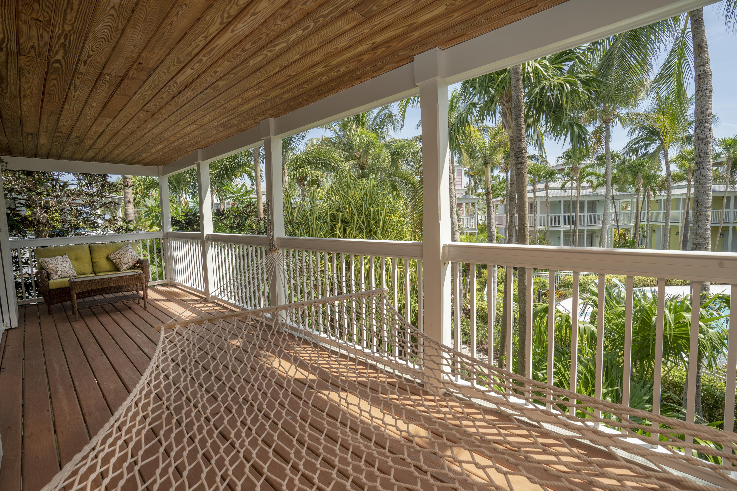 70 Sunset Key Drive Key West, FL 33040 - Photo 16 of 22 a view of a wooden deck with a yard