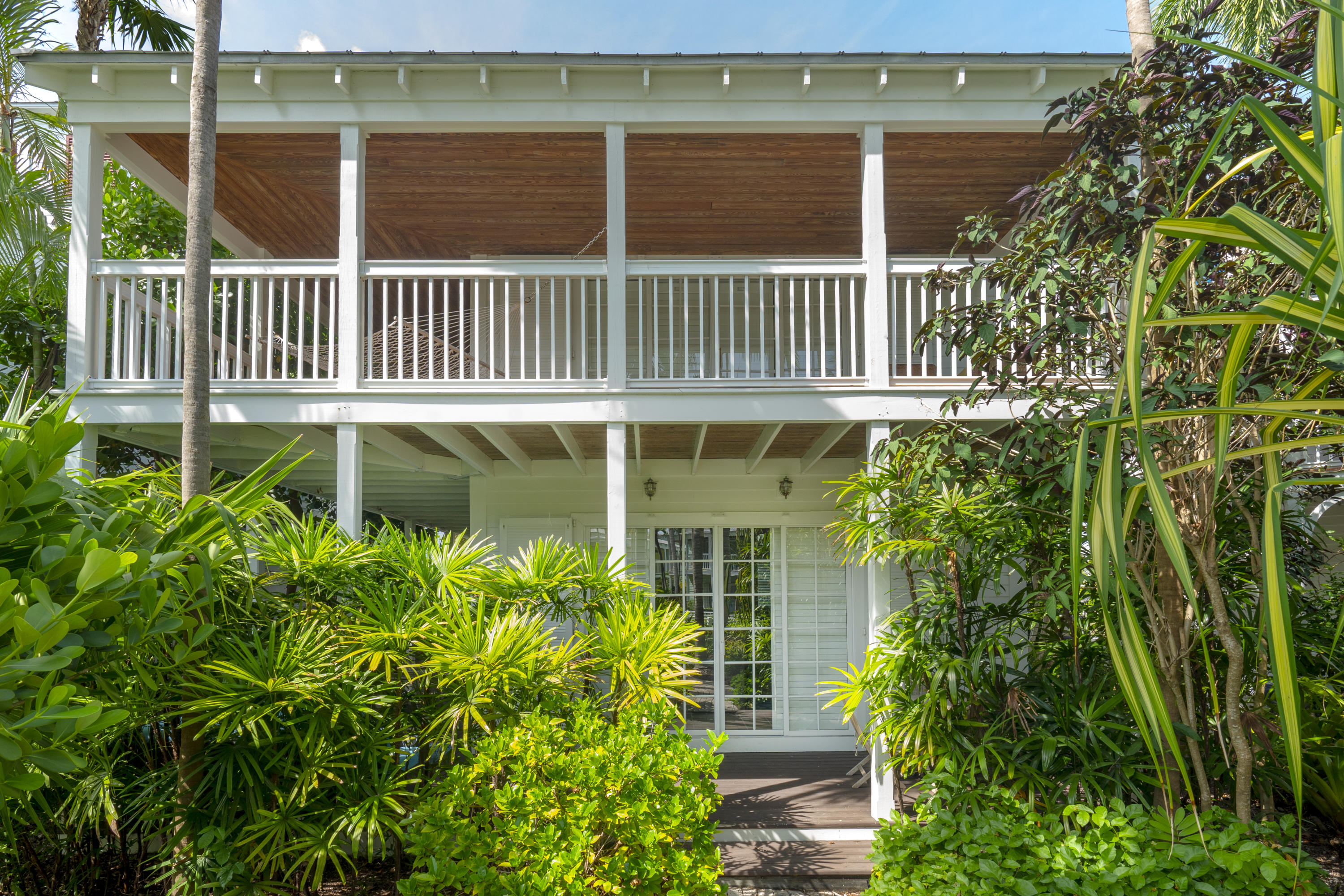 70 Sunset Key Drive Key West, FL 33040 - Photo 20 of 22 a view of a house with a garden