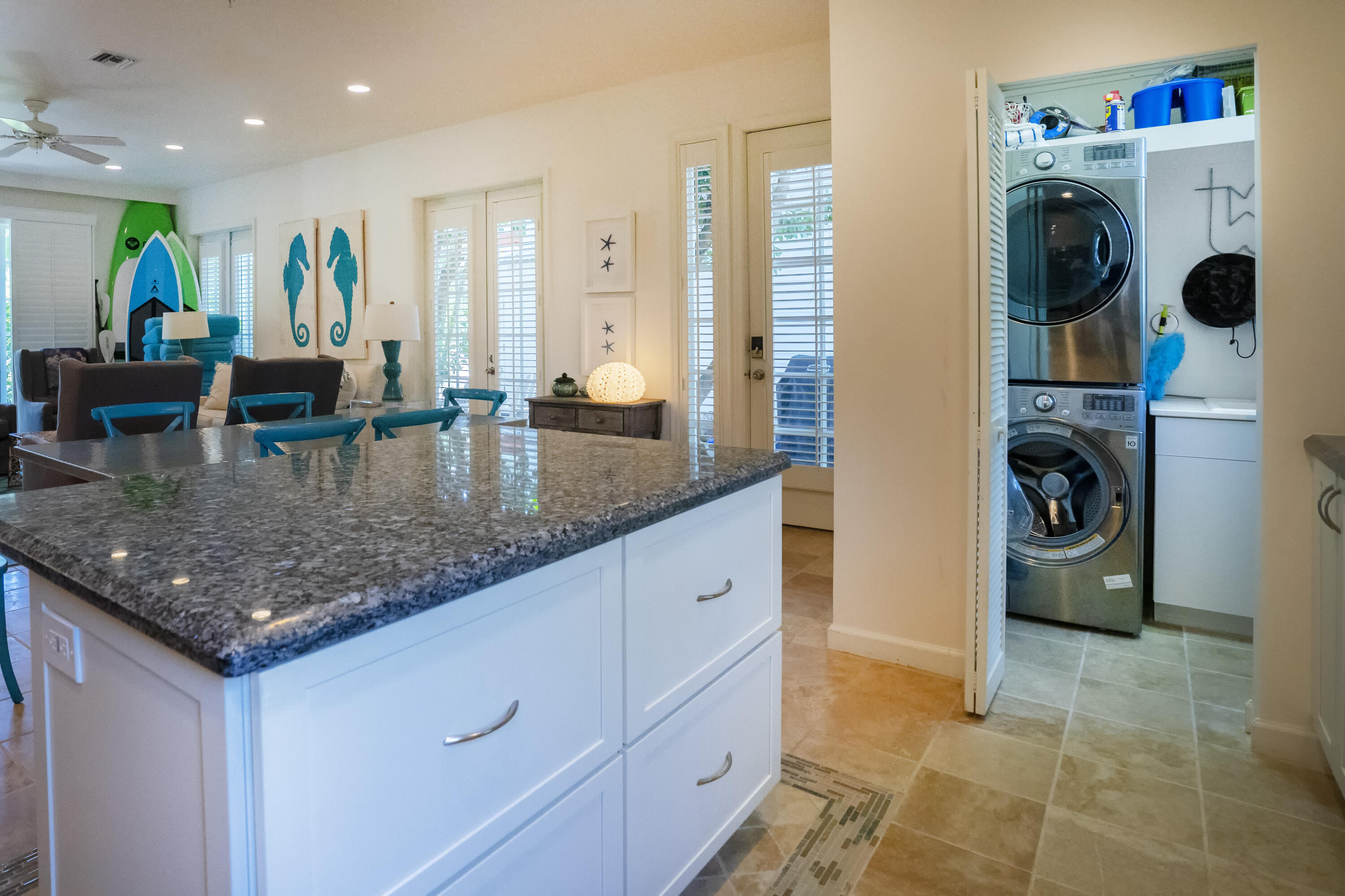 70 Sunset Key Drive Key West, FL 33040 - Photo 4 of 22 a bathroom with a granite countertop sink a mirror and shower
