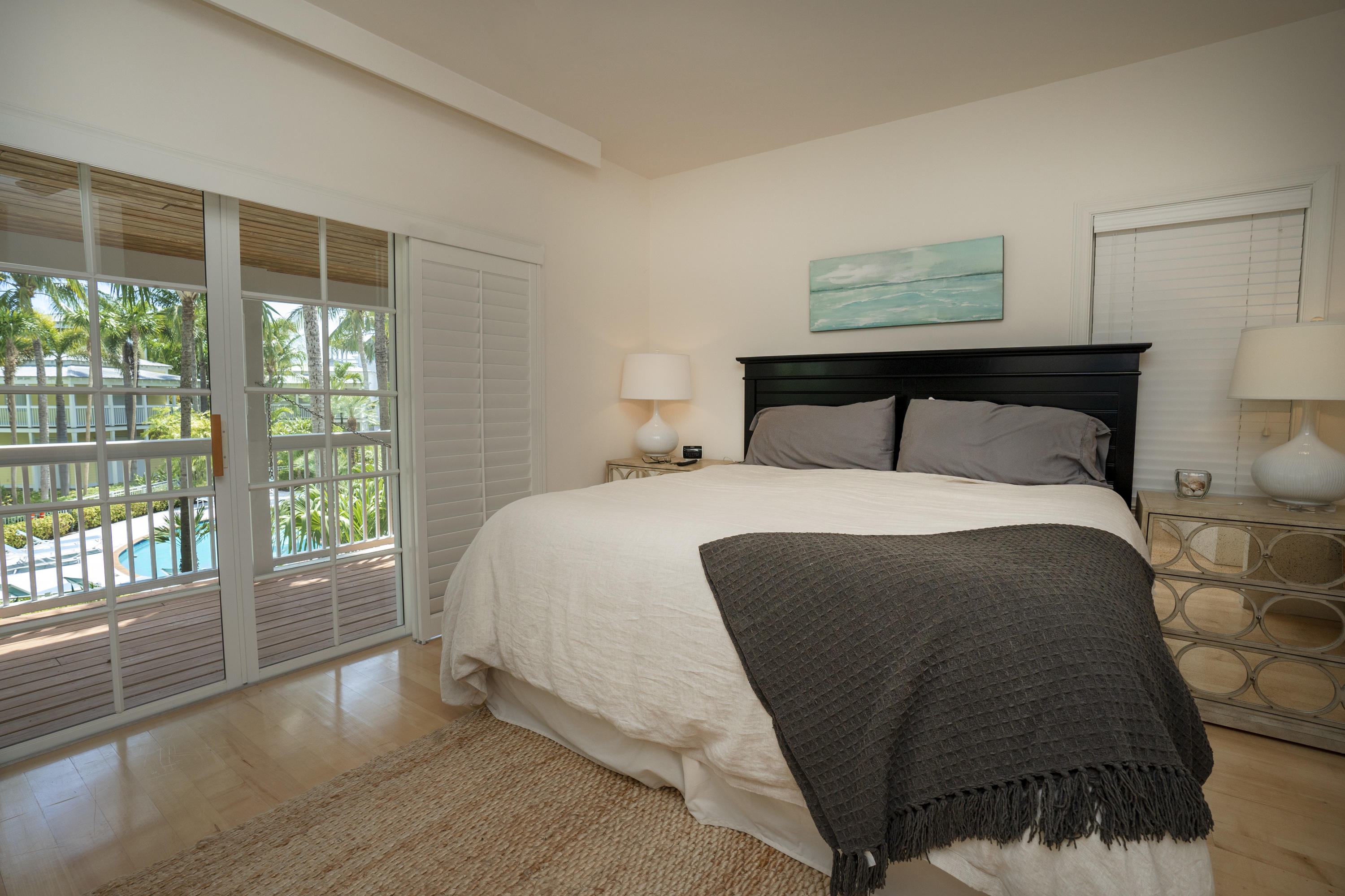 70 Sunset Key Drive Key West, FL 33040 - Photo 9 of 22 a bedroom with a bed and a large window