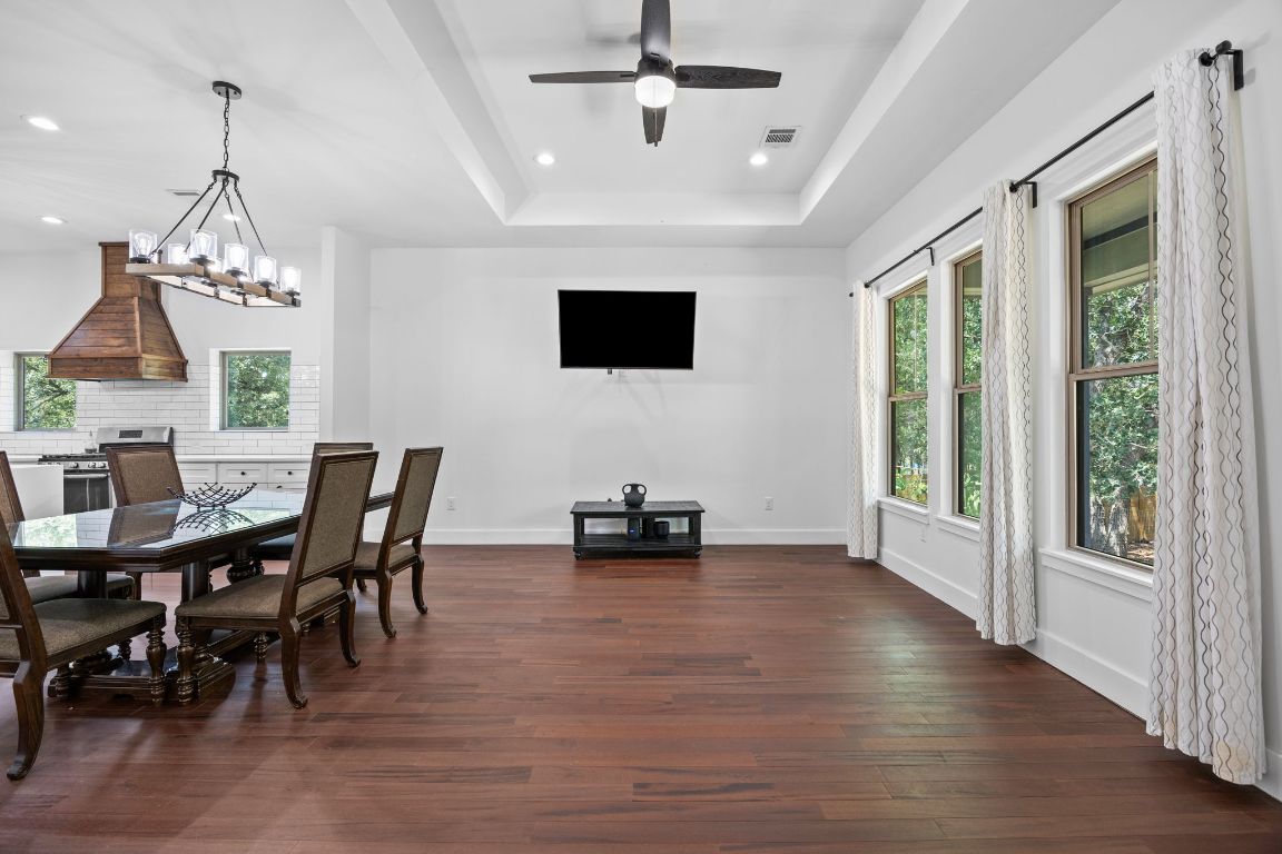 390 Riddle Road Cedar Creek, TX 78612 - Photo 12 of 27 a view of a dining room with furniture window and wooden floor