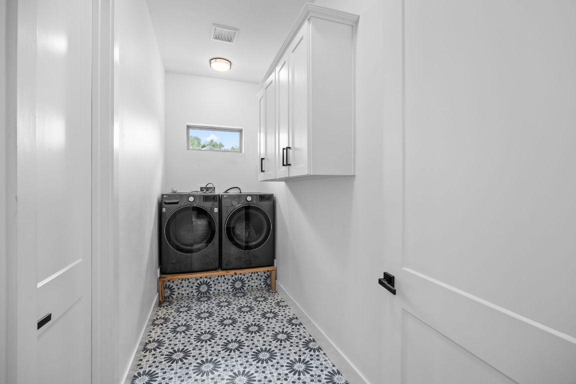 390 Riddle Road Cedar Creek, TX 78612 - Photo 25 of 27 a bathroom with a bathtub and a shower