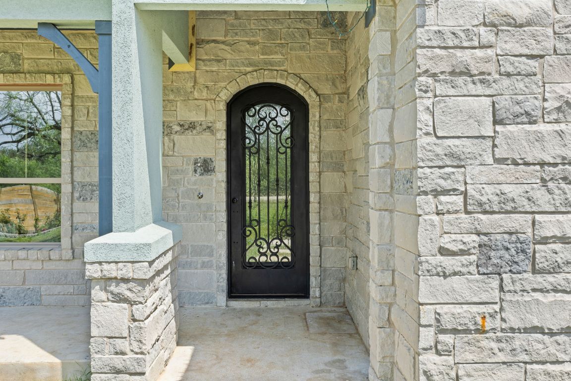 390 Riddle Road Cedar Creek, TX 78612 - Photo 3 of 27 a view of a door with glass door