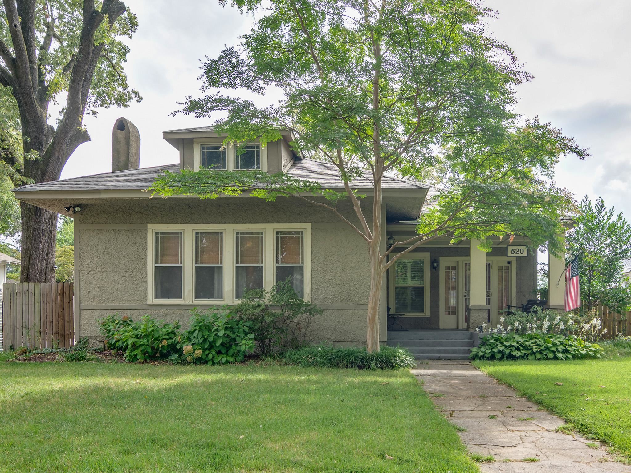 Bungalow-style home with covered porch and roof with shingles