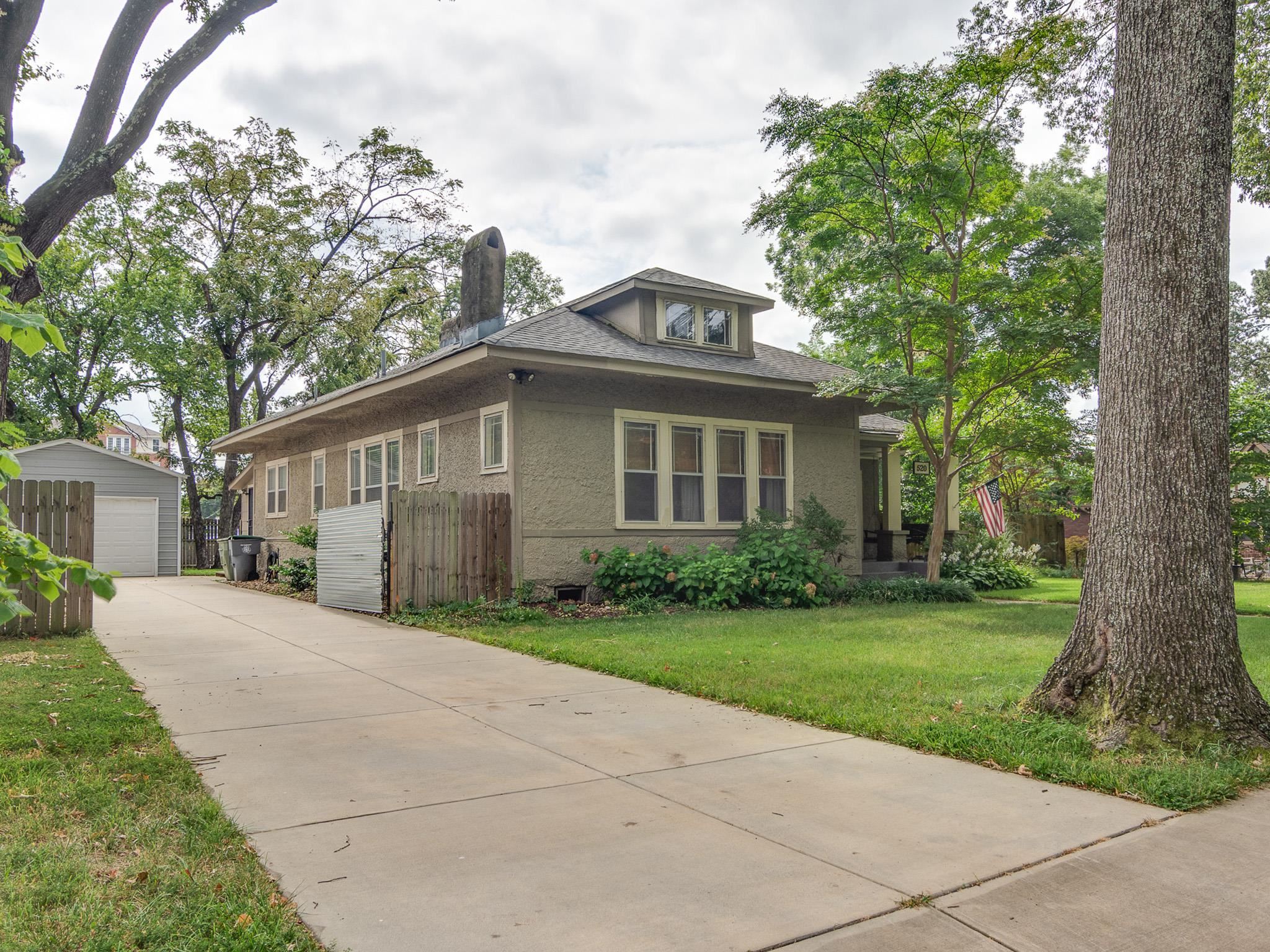 520 Ellsworth Street Memphis, TN 38111 - Photo 2 of 37 Bungalow-style home with an outdoor structure, a chimney, a detached garage, a front yard, and a shingled roof