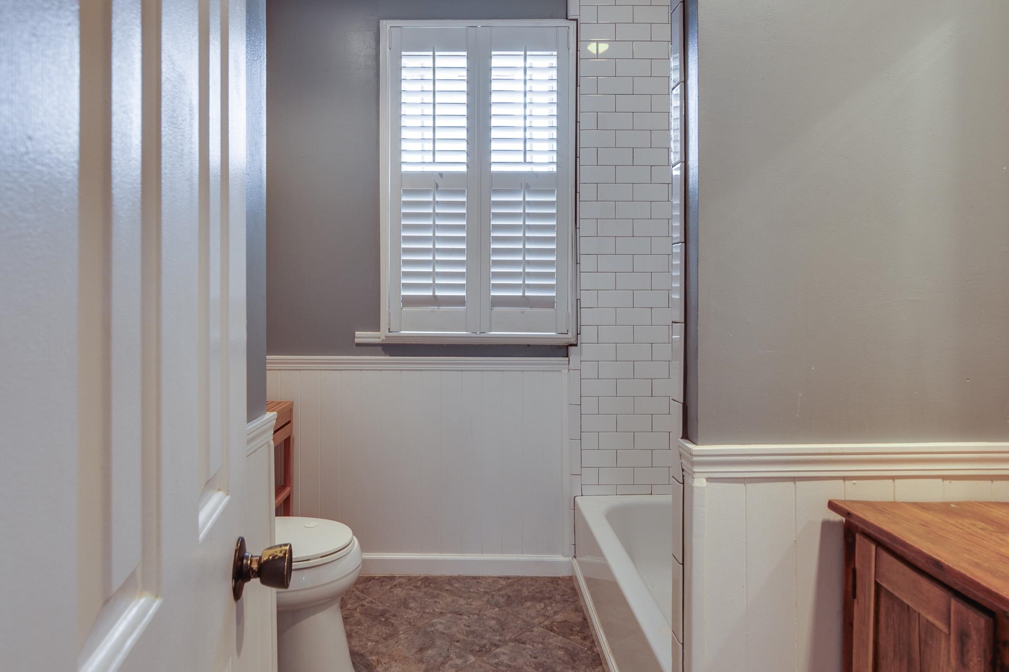 520 Ellsworth Street Memphis, TN 38111 - Photo 25 of 37 Bathroom with vanity and a wainscoted wall
