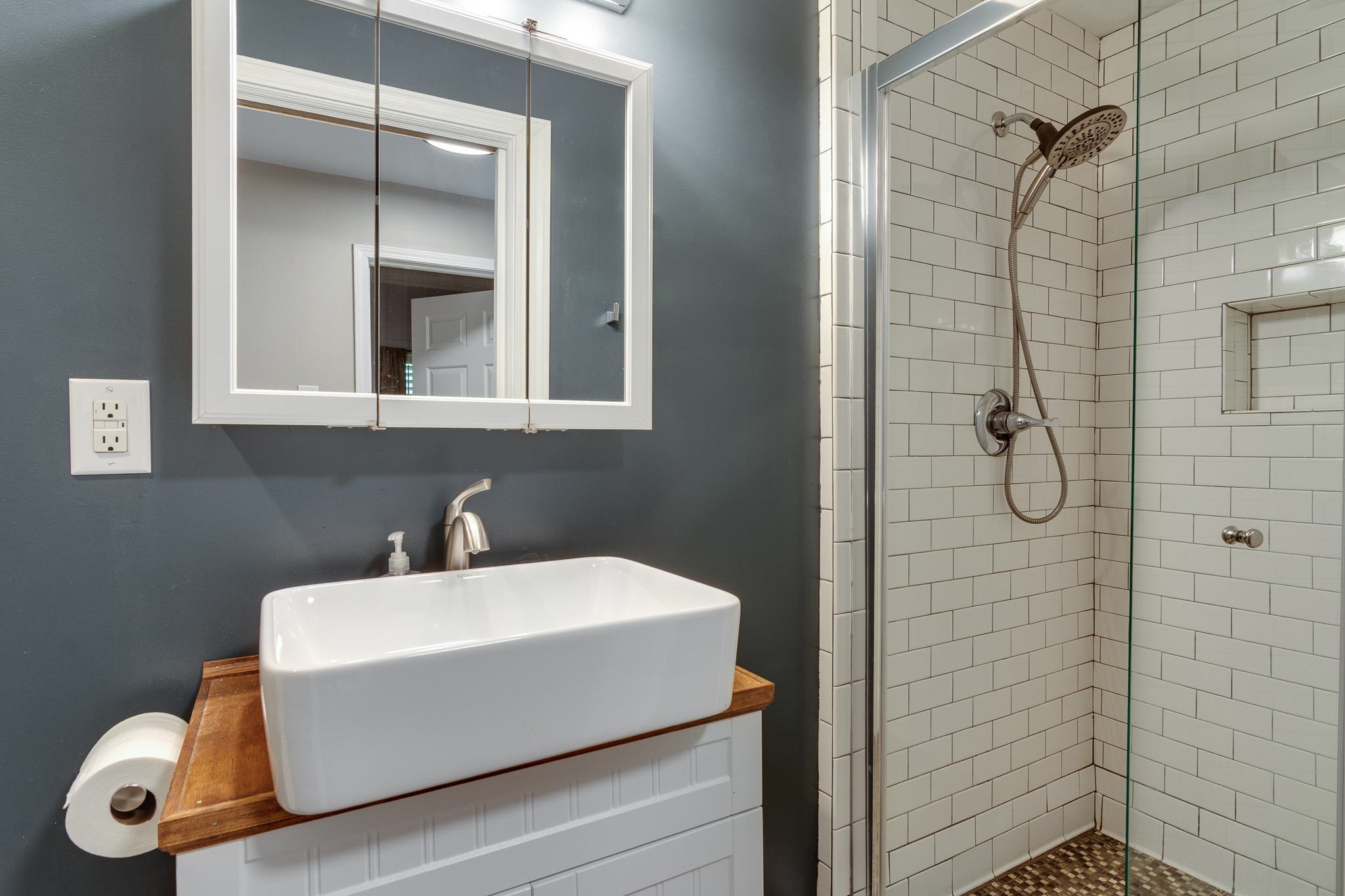 520 Ellsworth Street Memphis, TN 38111 - Photo 28 of 37 Full bathroom featuring a stall shower and vanity