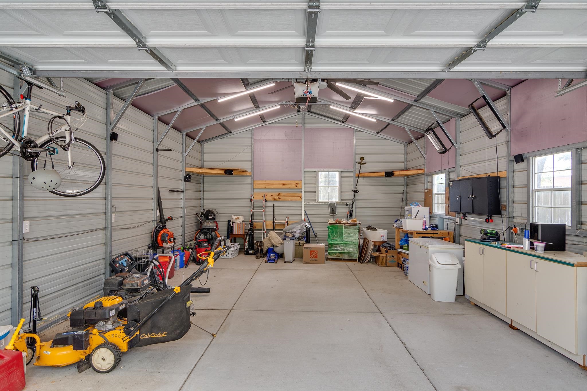 520 Ellsworth Street Memphis, TN 38111 - Photo 33 of 37 Garage with metal wall and a garage door opener