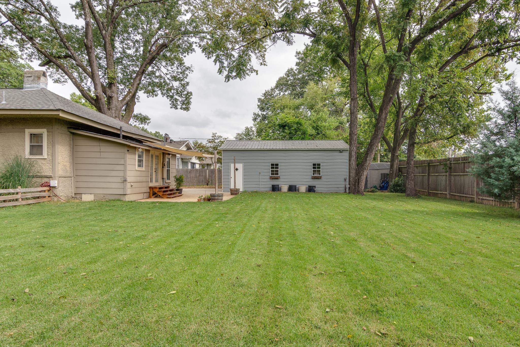 520 Ellsworth Street Memphis, TN 38111 - Photo 36 of 37 Fenced backyard with an outbuilding and a patio area