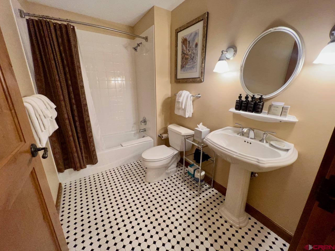 620 Gothic Road, Unit 606 Crested Butte, CO 81225 - Photo 21 of 28 a bathroom with a sink toilet and shower