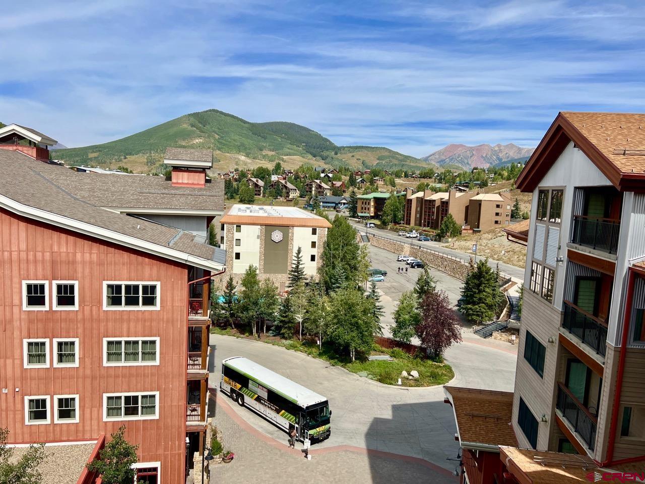 620 Gothic Road, Unit 606 Crested Butte, CO 81225 - Photo 22 of 28 a view of a city with tall buildings and a big yard