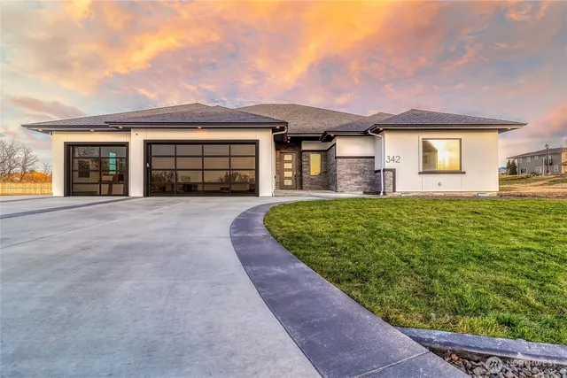 front view of a house with a yard