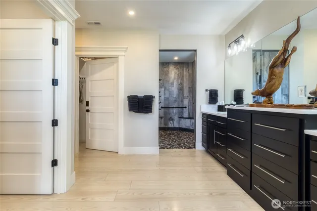 a kitchen with a refrigerator and a sink