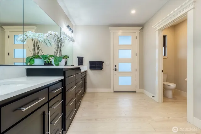 a bathroom with a sink and a mirror