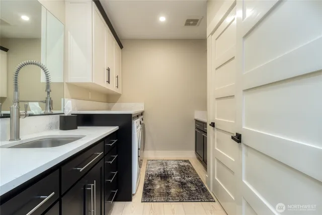 a kitchen with a sink and a refrigerator