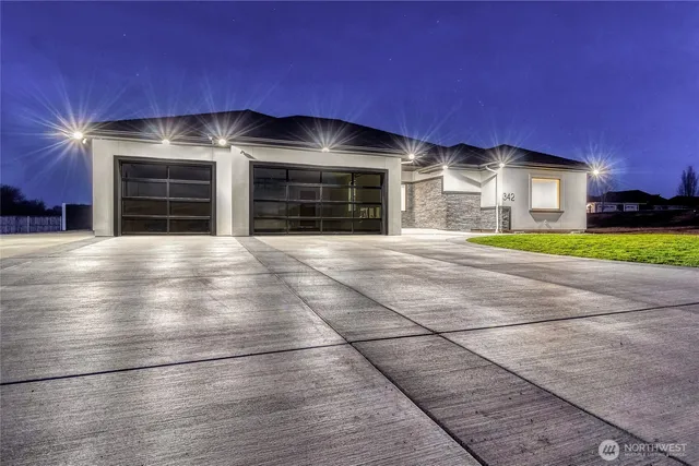 a view of a house with a yard and garage