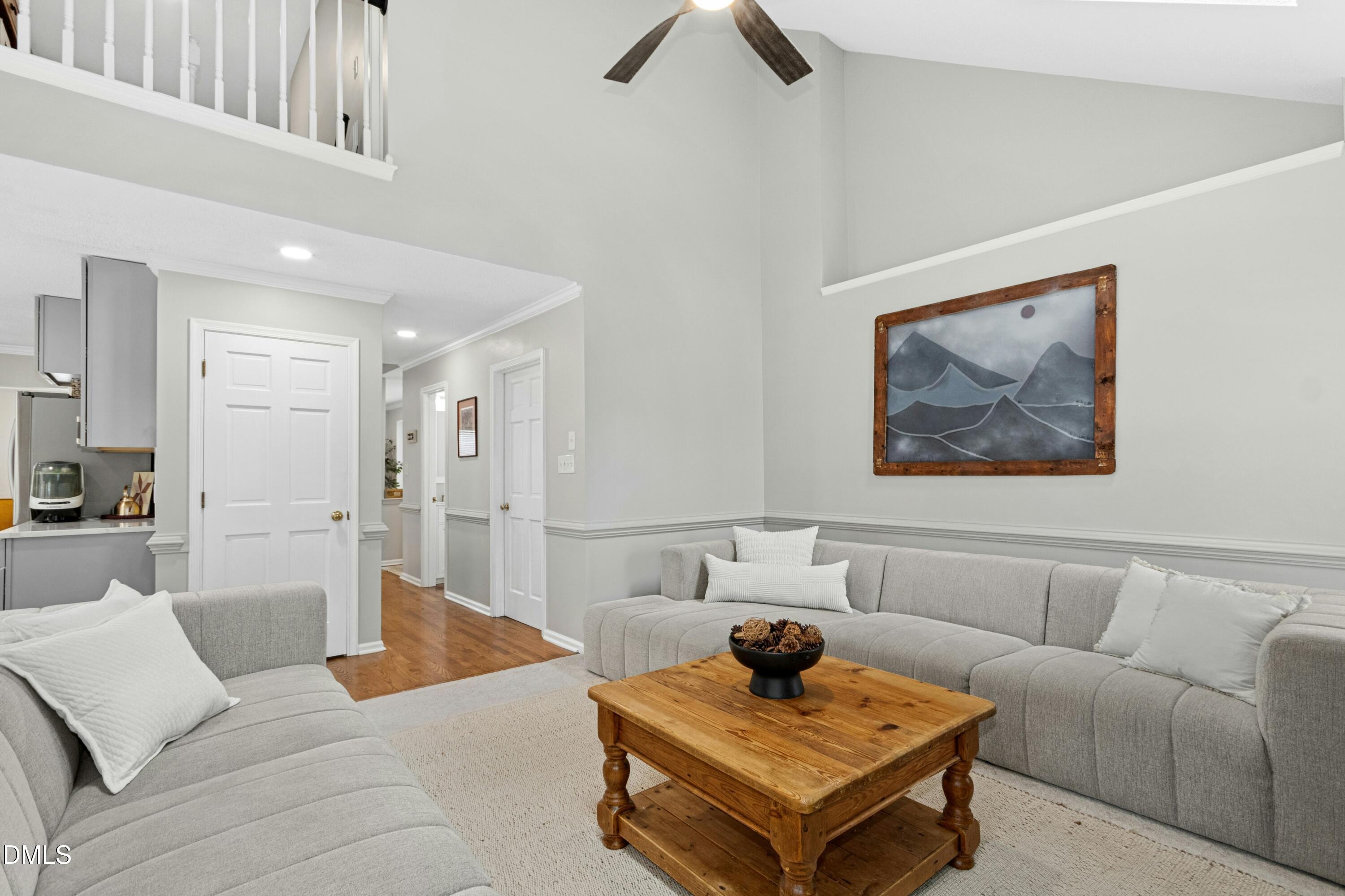 8616 Vanburgh Court Raleigh, NC 27615 - Photo 17 of 38 a living room with furniture and a rug