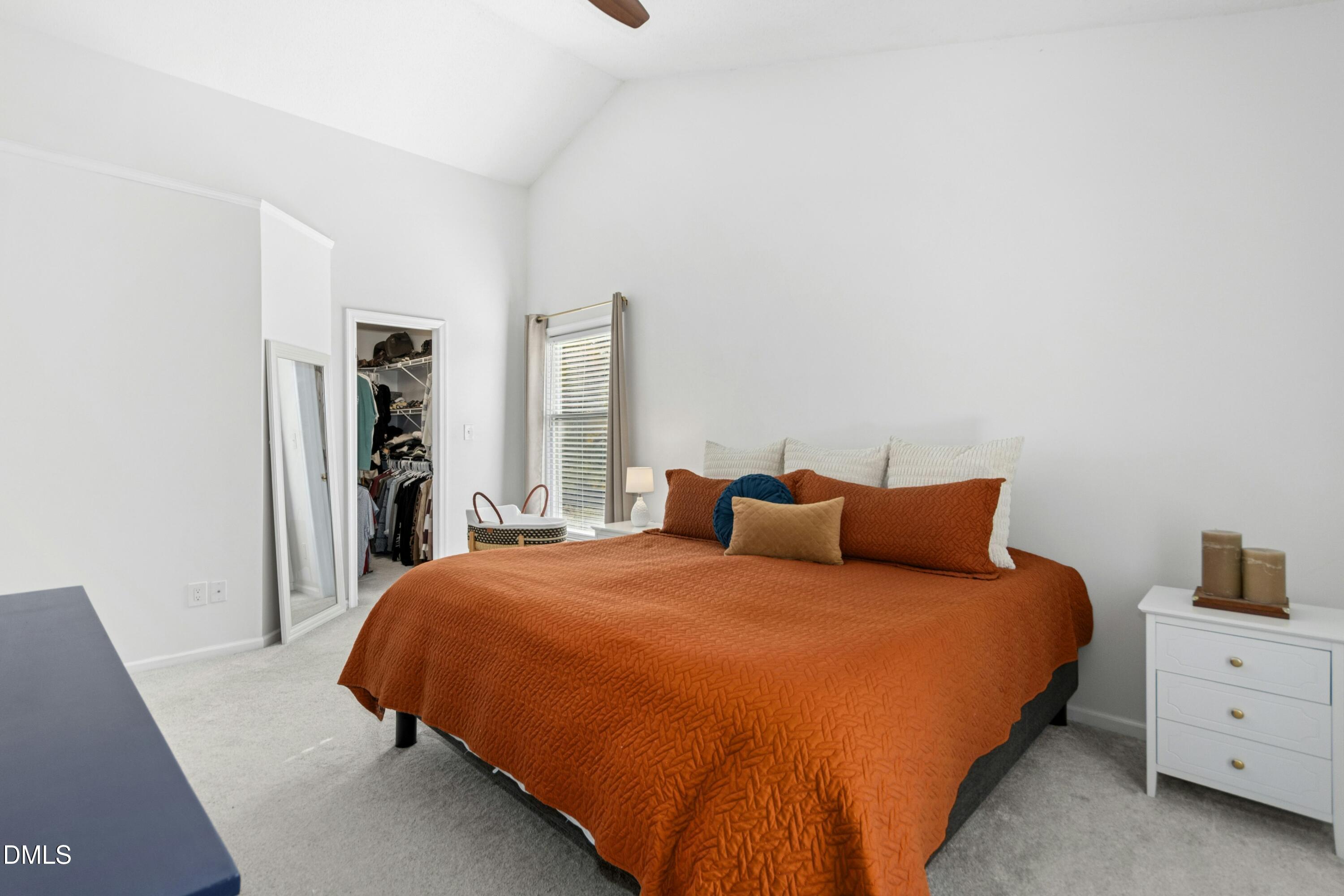 8616 Vanburgh Court Raleigh, NC 27615 - Photo 27 of 38 a bedroom with a bed and closet