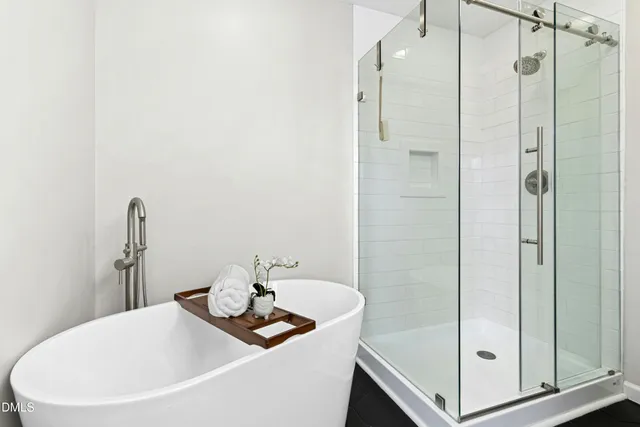 a bathroom with a tub and sink