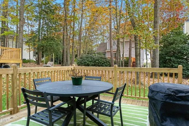 a view of a chairs and table on the deck