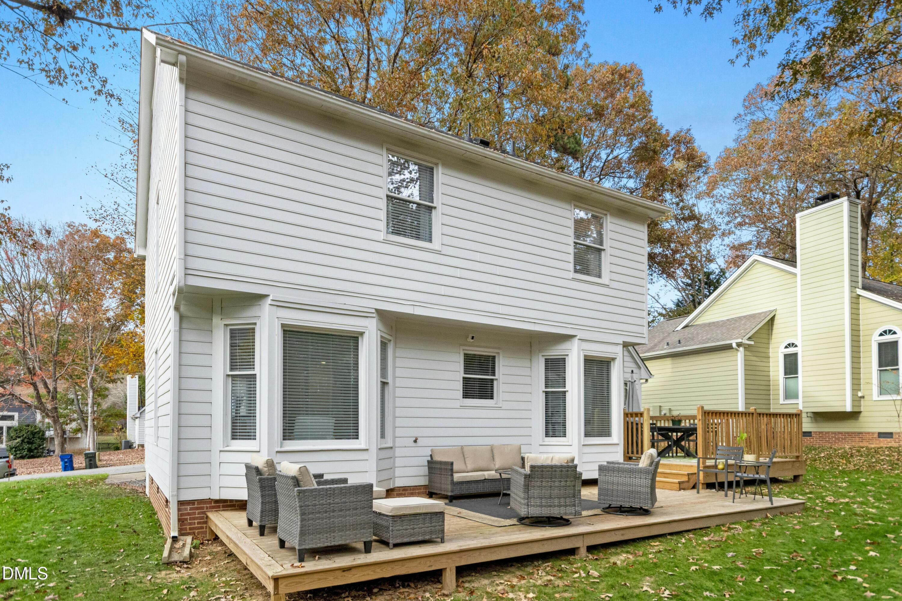 8616 Vanburgh Court Raleigh, NC 27615 - Photo 35 of 38 a view of a house with backyard sitting area and garden