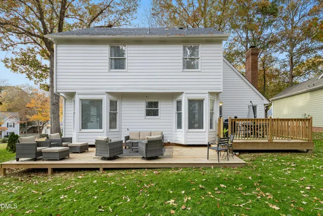 a front view of a house with a garden and patio