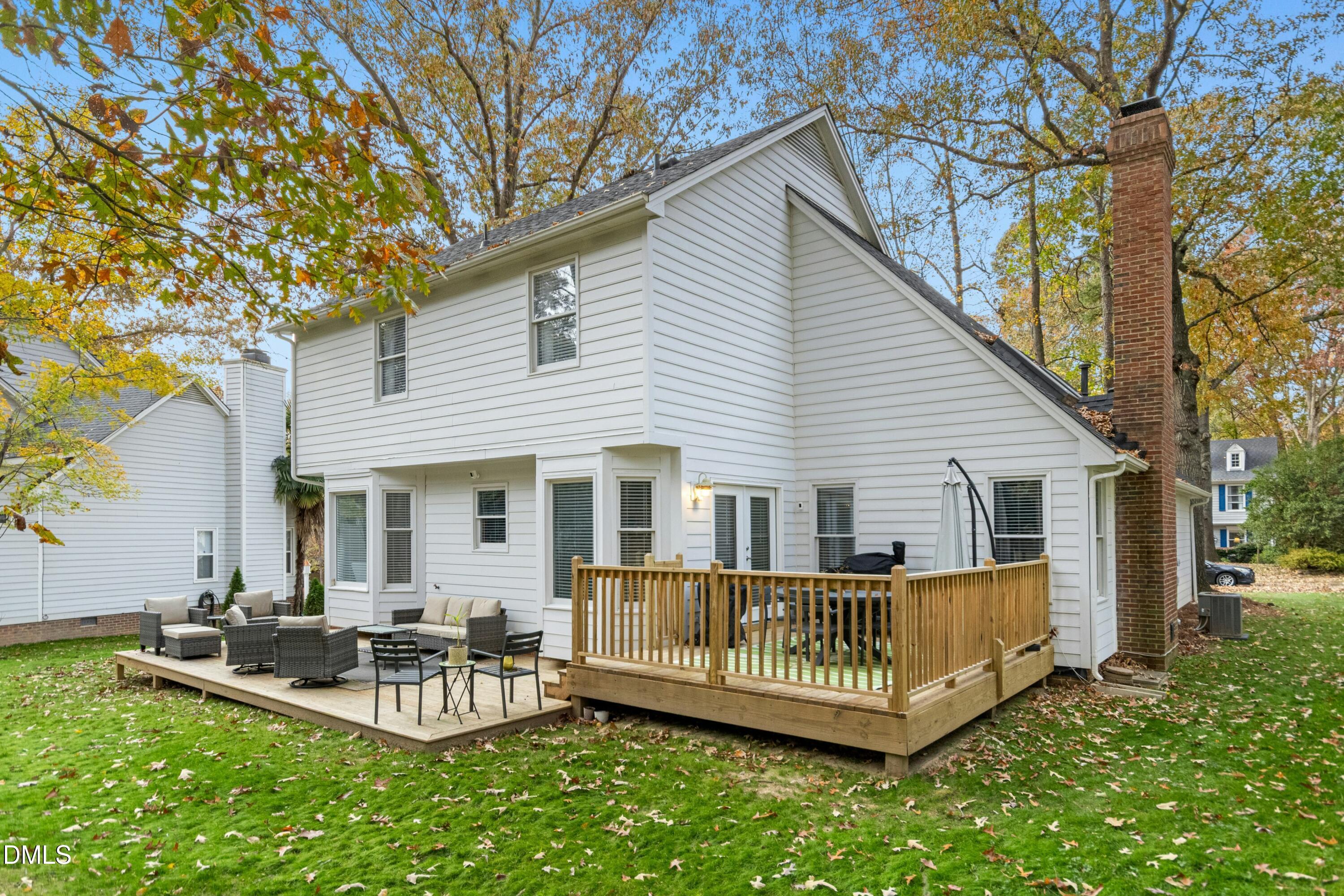 8616 Vanburgh Court Raleigh, NC 27615 - Photo 37 of 38 a view of a house with a backyard and sitting area