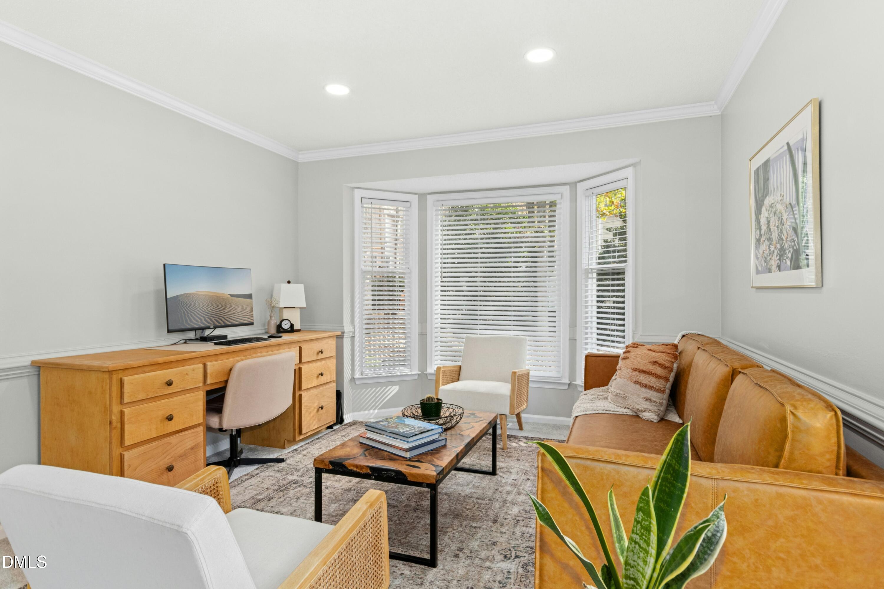 8616 Vanburgh Court Raleigh, NC 27615 - Photo 5 of 38 a living room with furniture and a window
