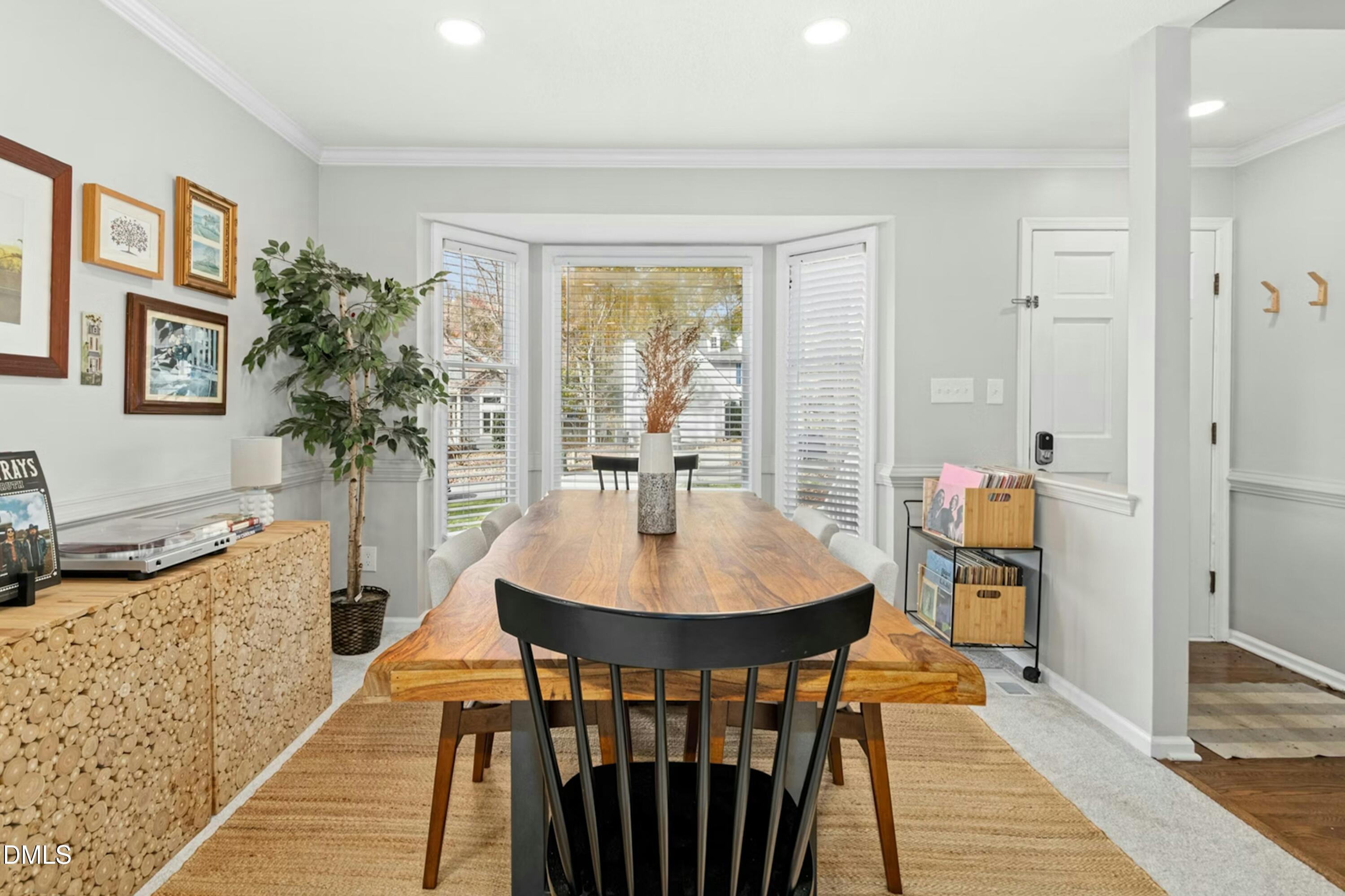 8616 Vanburgh Court Raleigh, NC 27615 - Photo 8 of 38 a dining room with furniture and window