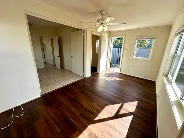 a view of livingroom with hardwood floor and hallway
