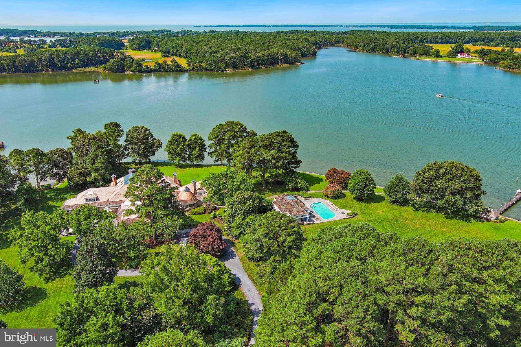 an aerial view of a houses with a lake view